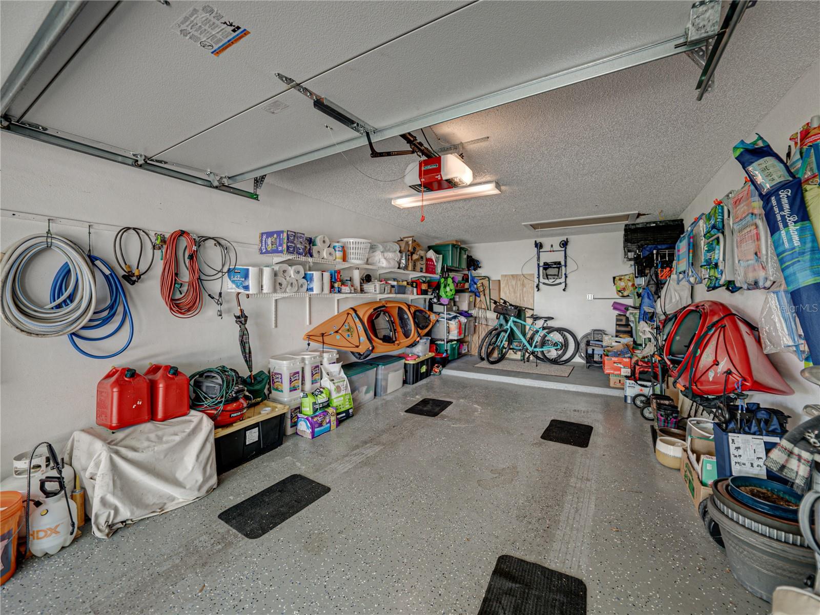 Garage big enough for golf cart, car, and all your toys~