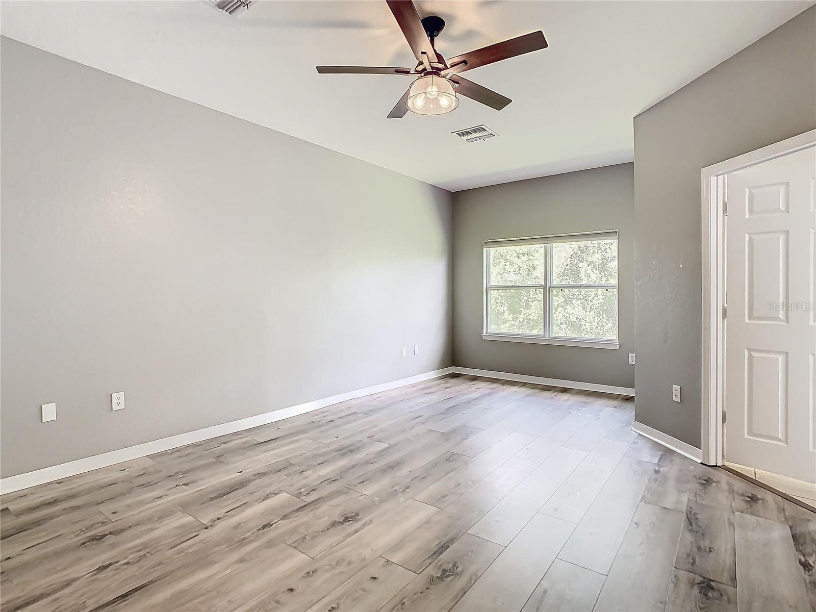 Primary bedroom - luxury vinyl plank flooring