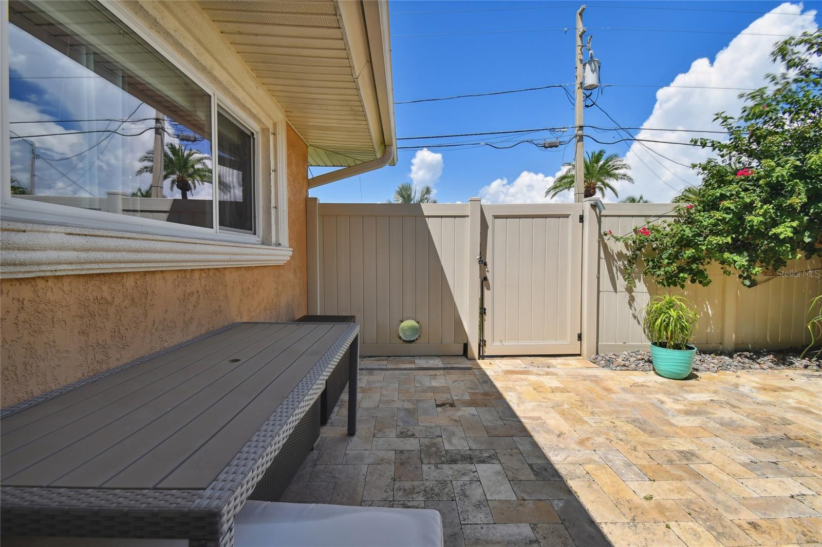 patio off the family room with gate, and doggie window.