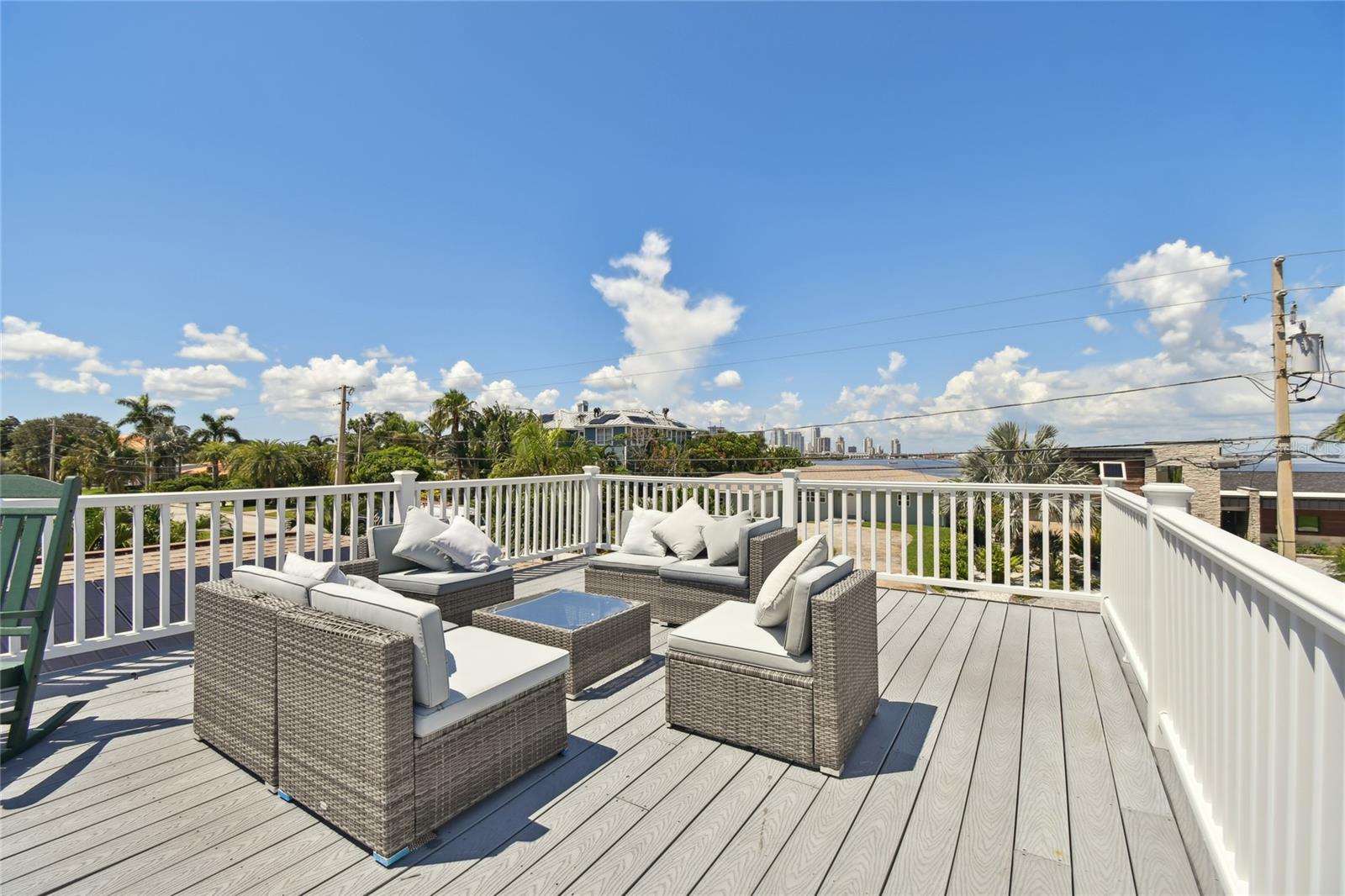 Giant deck looking to water from 3 sides, see Downtown St Pete in background.  We're not on the water but across the street from the way, less expenses but still great views.