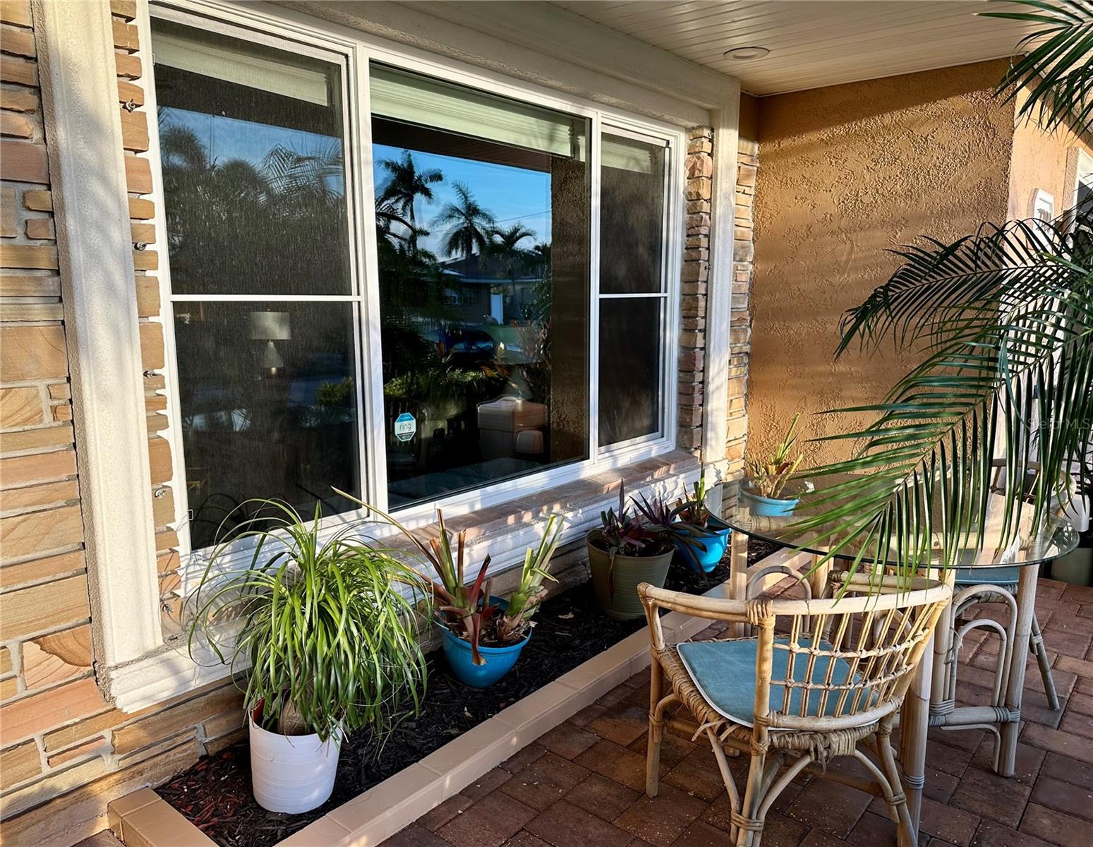 Picture window in front with patio