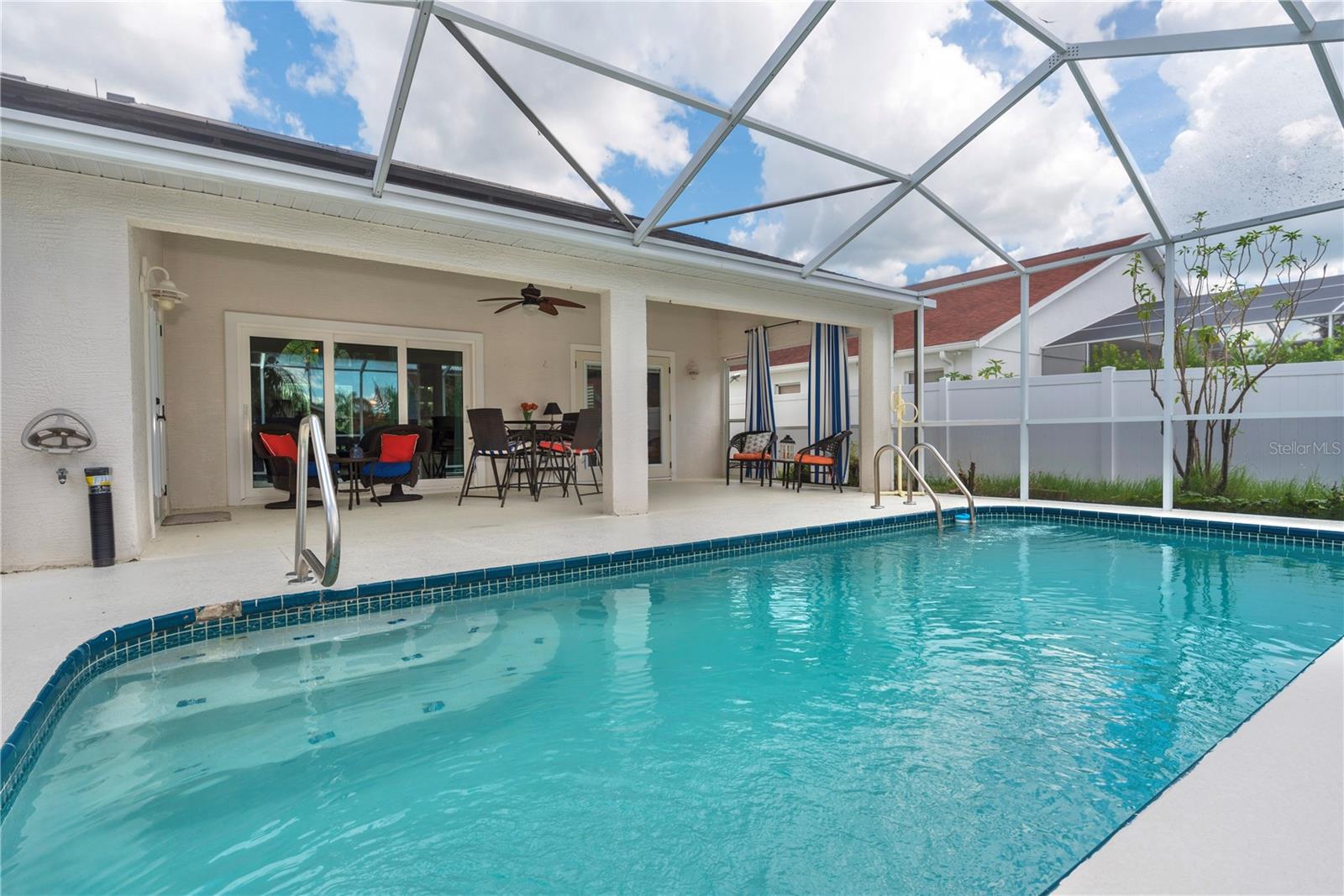 Pool with stairs and grab bar.