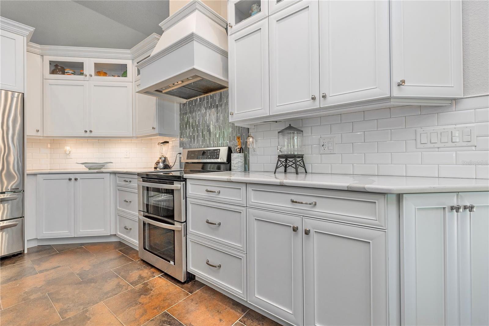 Glass front cabinet doors and crown molding.