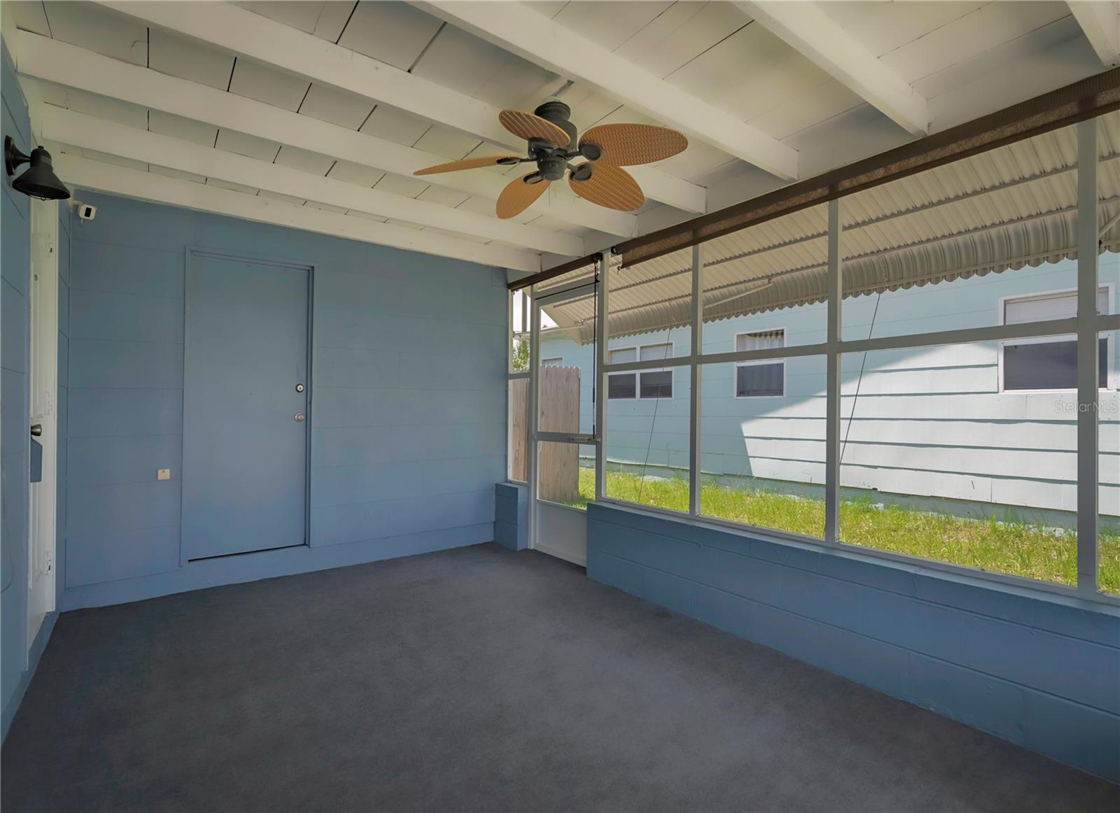 Enclosed porch with laundry room access