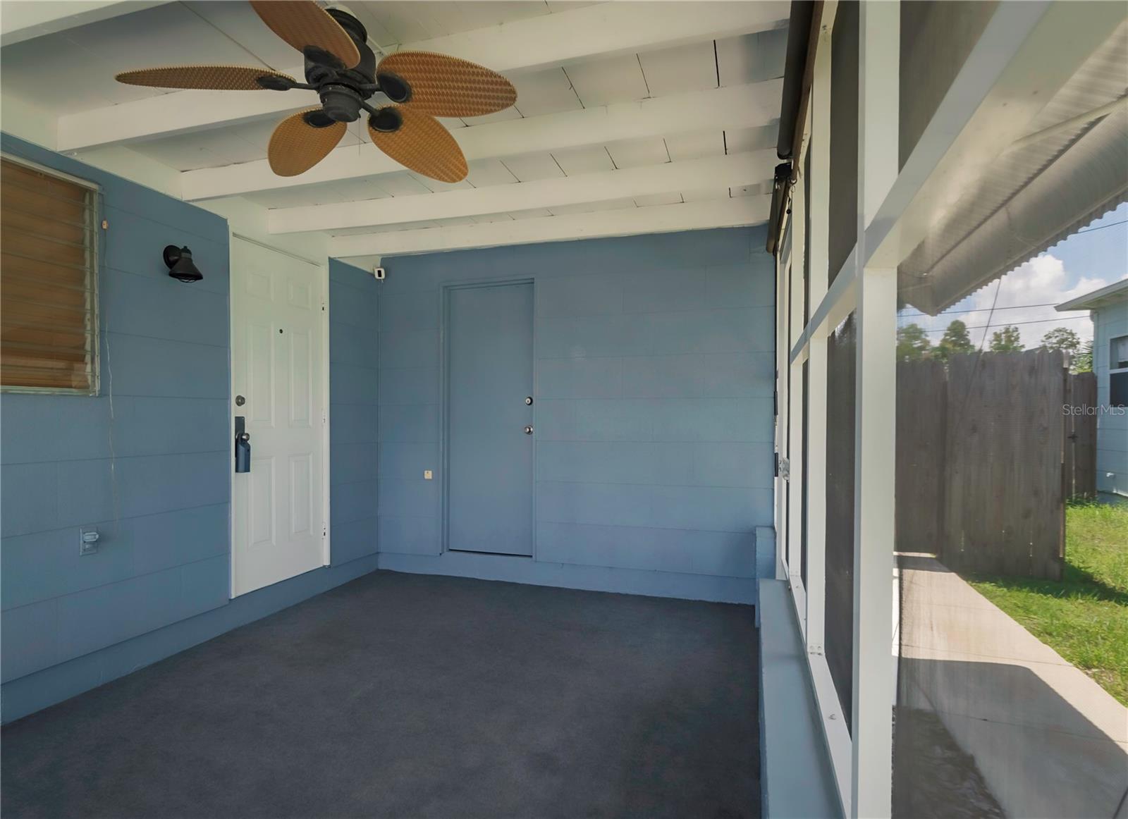 enclosed porch with laundry room access