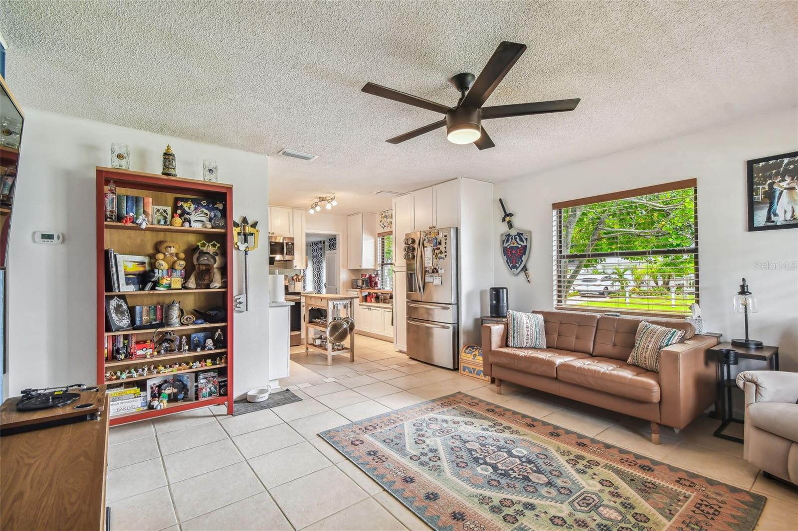 Living room with view into kitchen