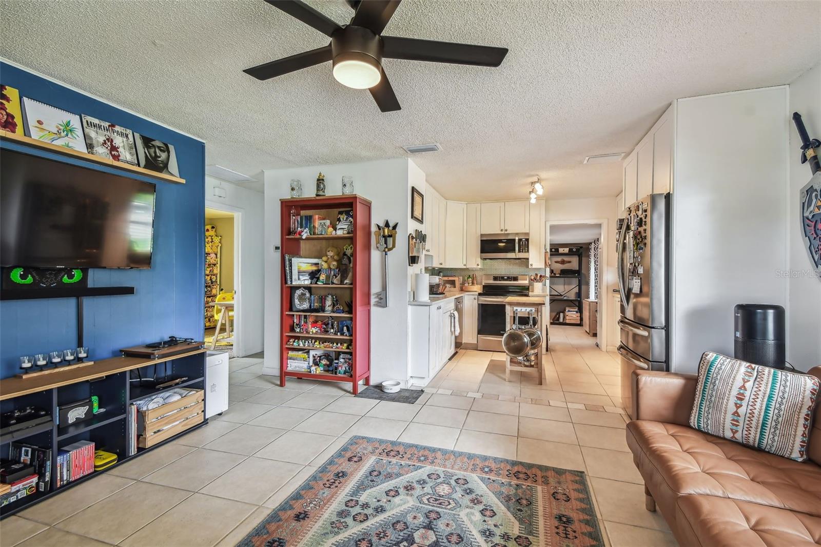 Living room with view into kitchen