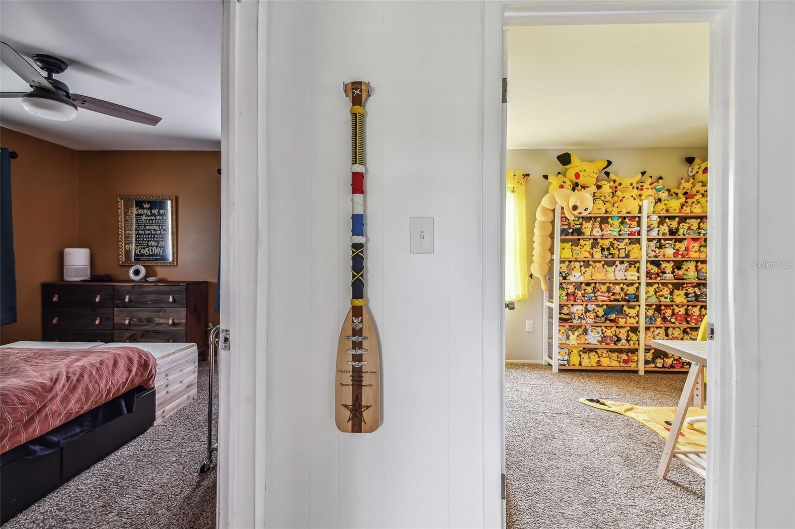 Hallway with view into both bedrooms