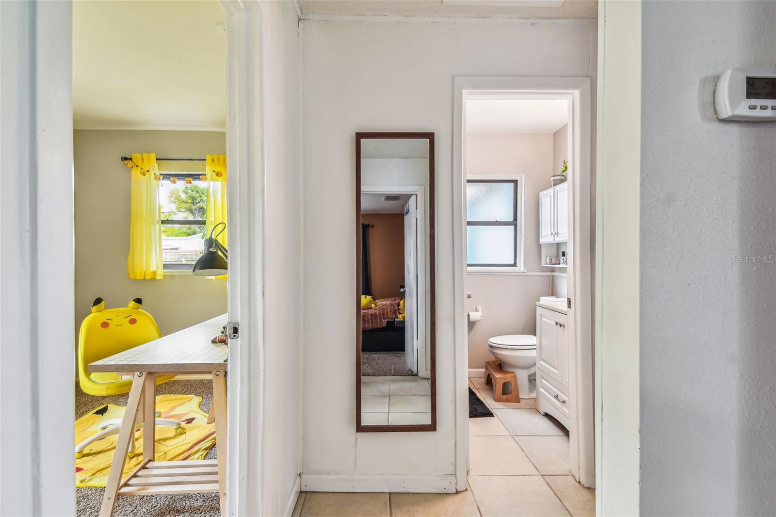 Hallway with view into bedroom #2 and bathroom