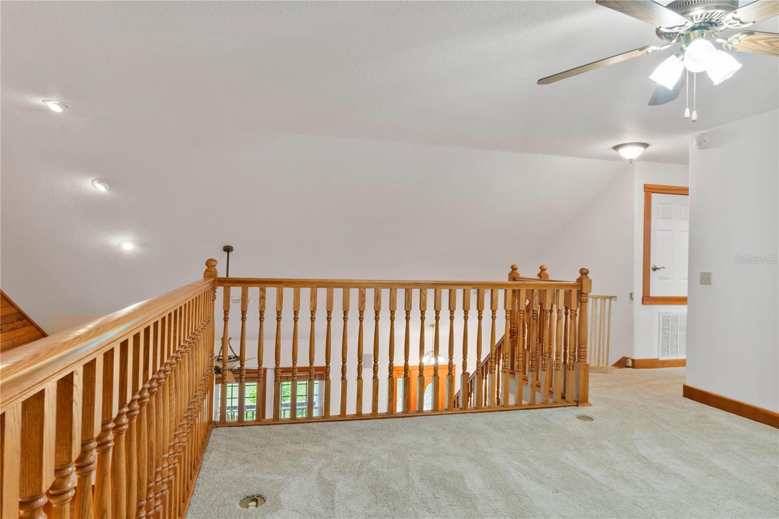 Upstairs loft looks down over living area...