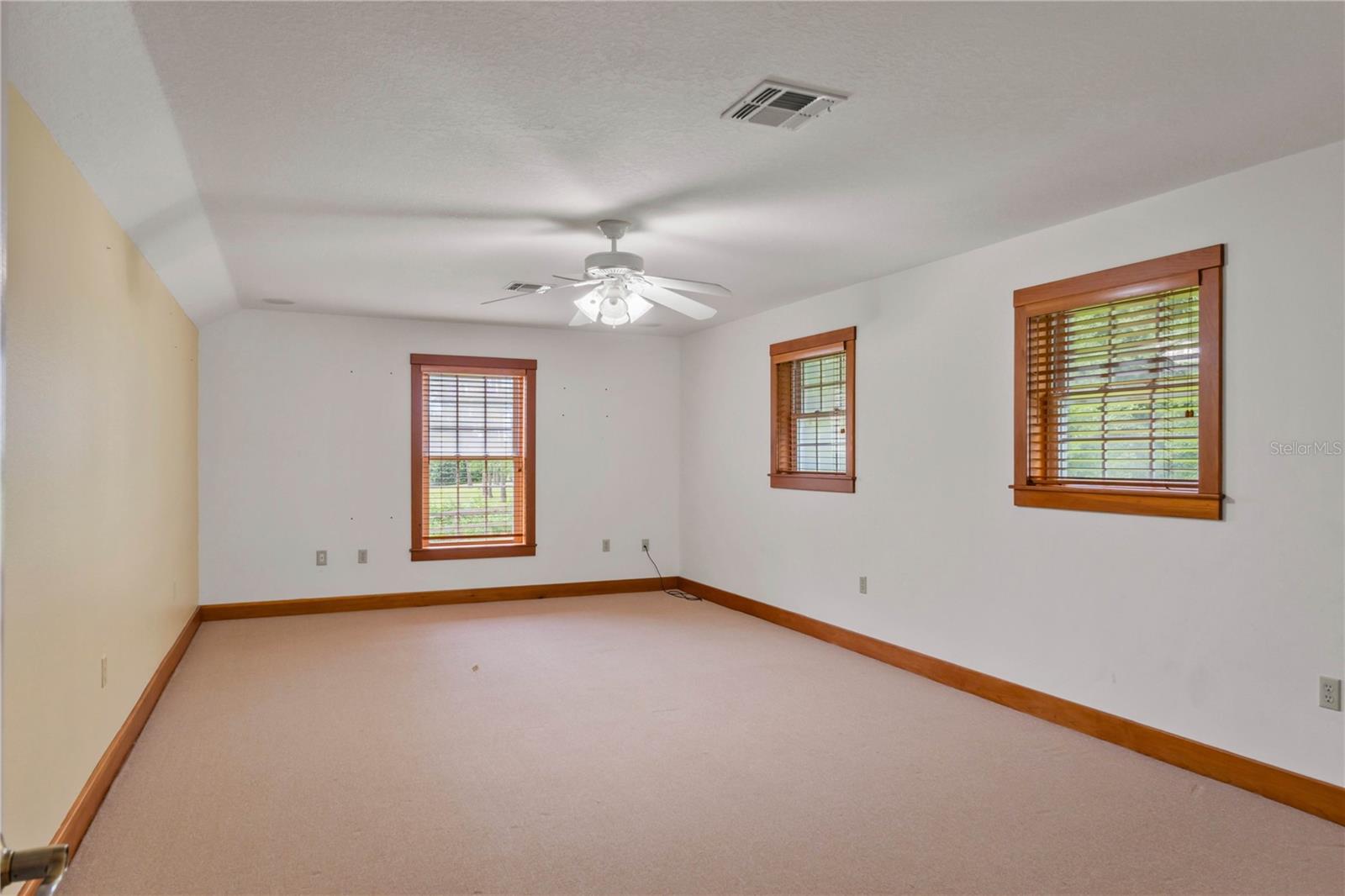 Oversized bonus room over the garage with lots of windows