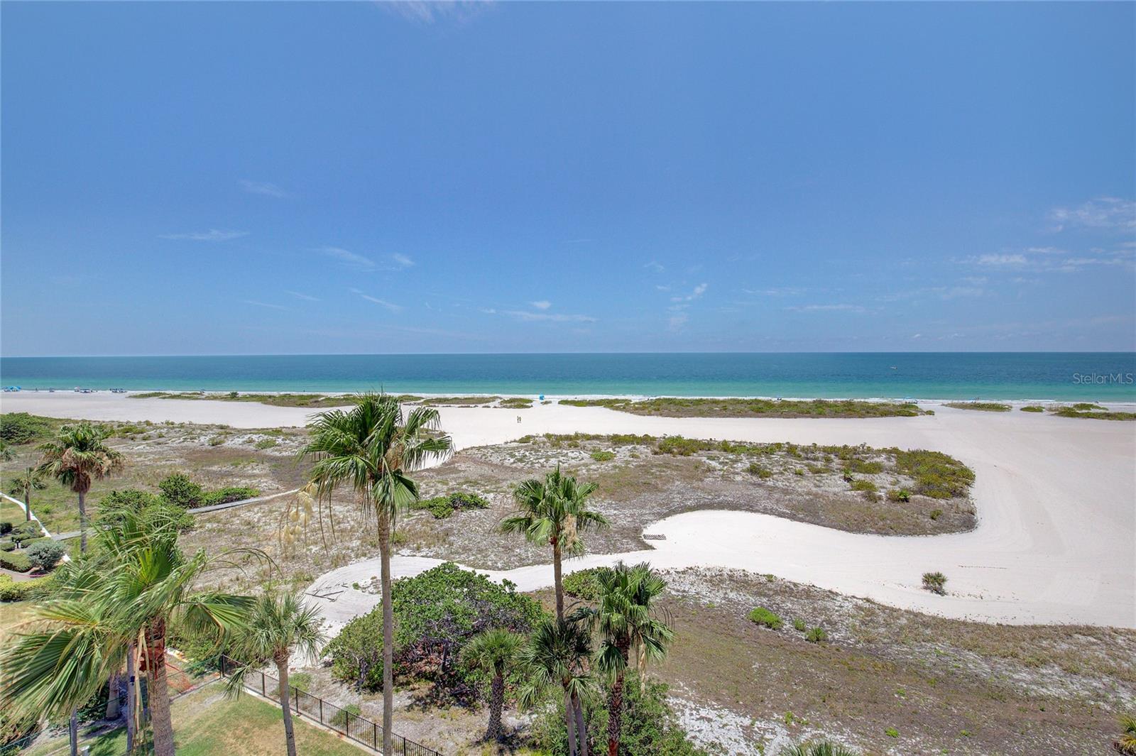 White sugary sand beach and emerald green waters.