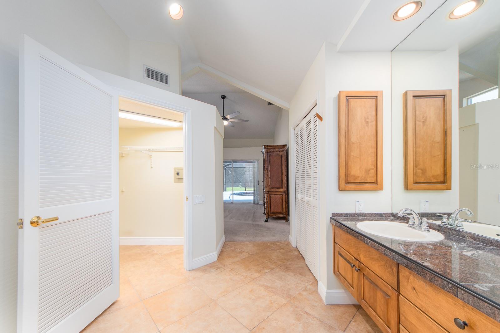 Primary bedroom walk in closet