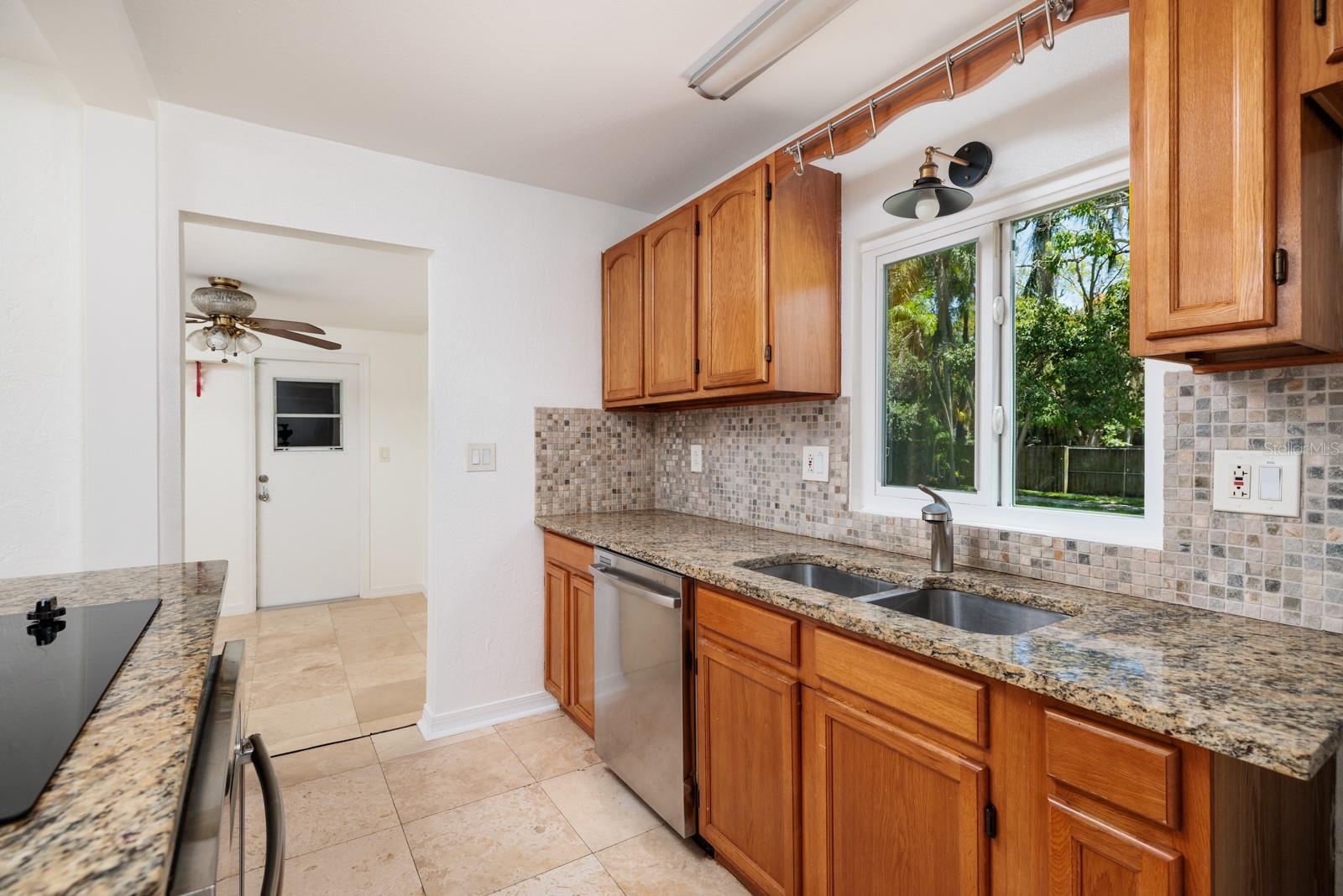 2017 Hurricane impact double pane window, granite countertops. Solid wood cabinets. Bonus room & garage door.