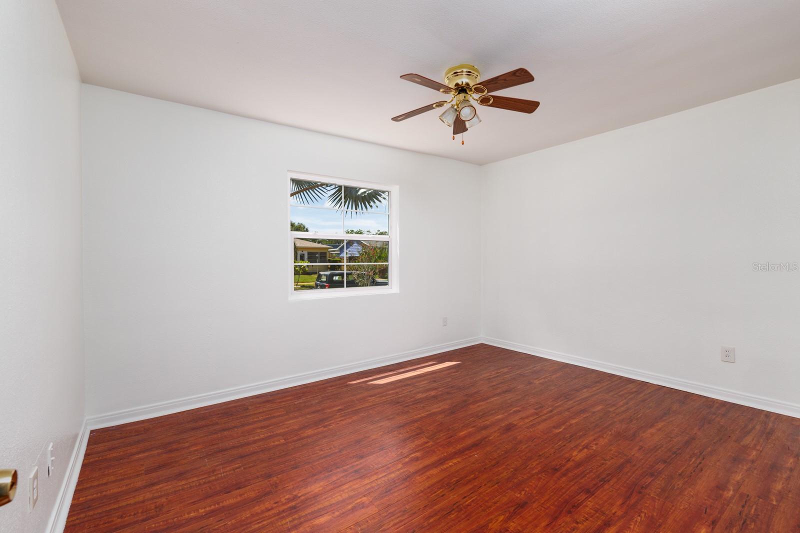 Primary bedroom w/2017 Hurricane impact double pane window.