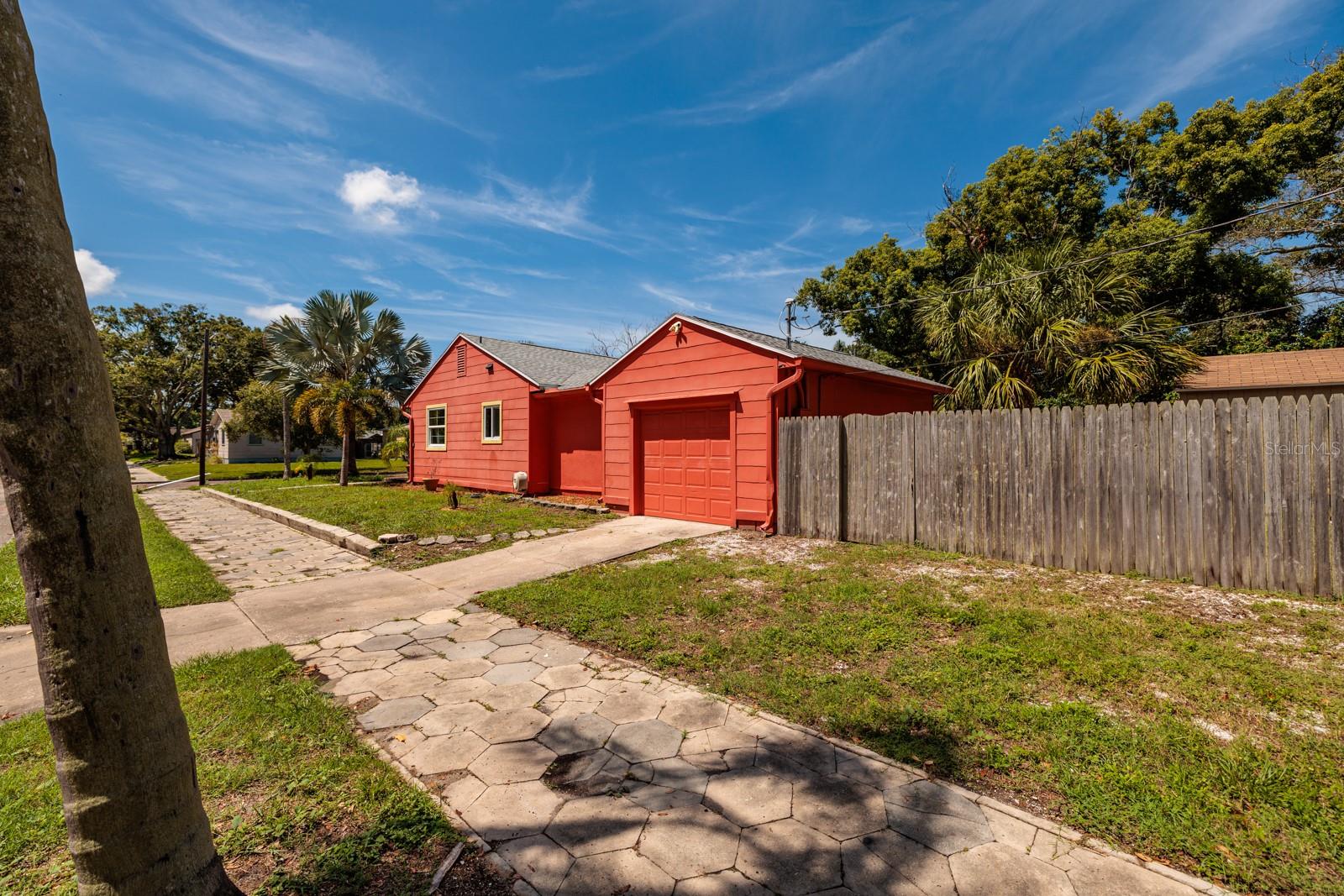 Driveway to garage & street parking allowed in front. Paver sidewalk.