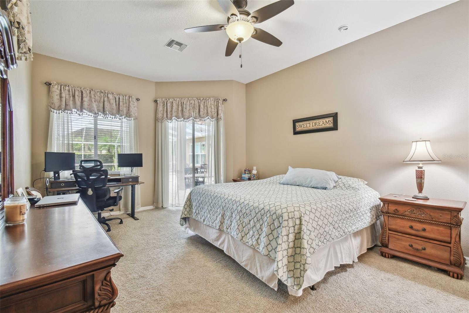 Primary Bedroom with sliders to pool area