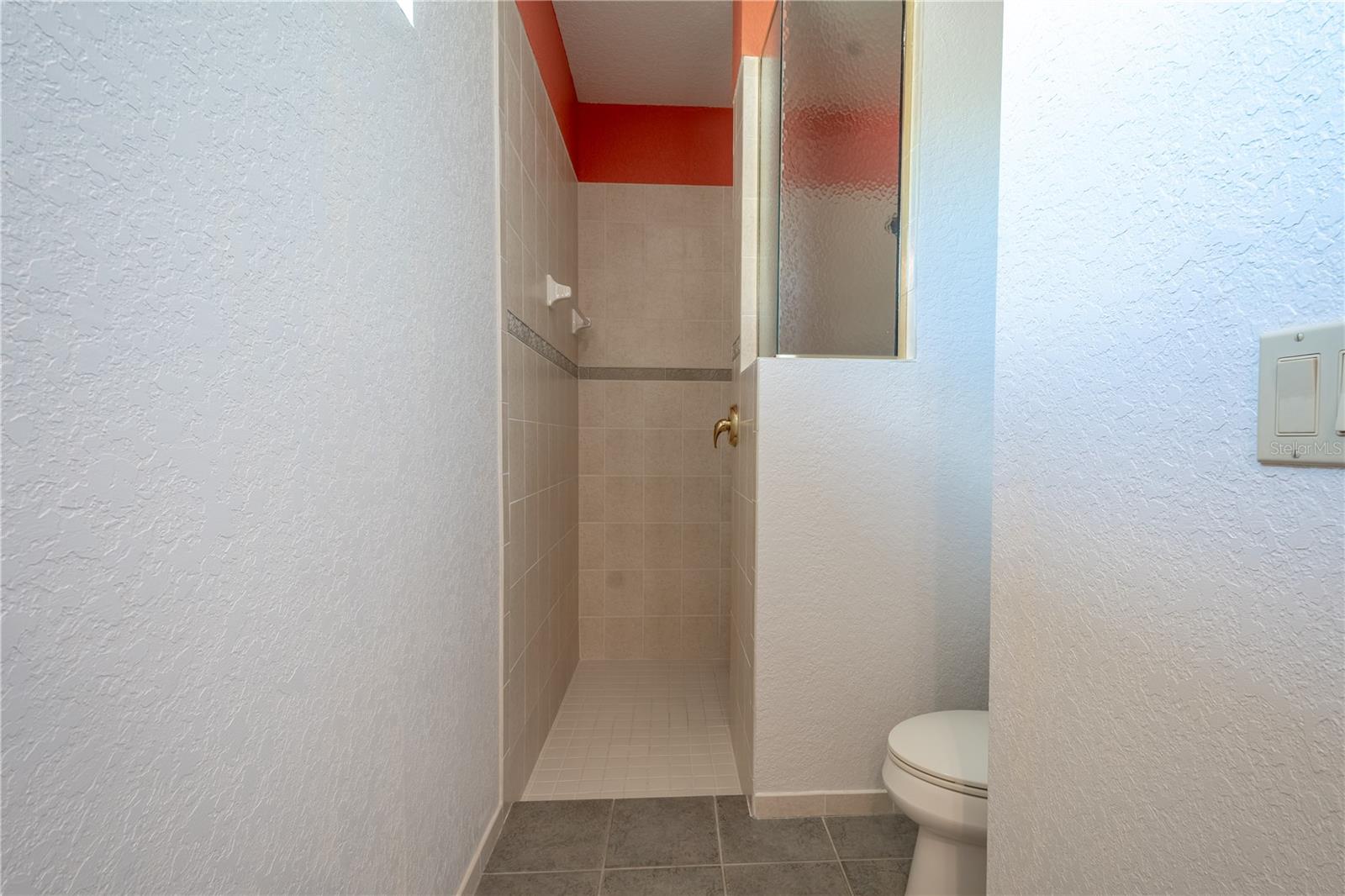 Bathroom 2 features a large walk-in shower.