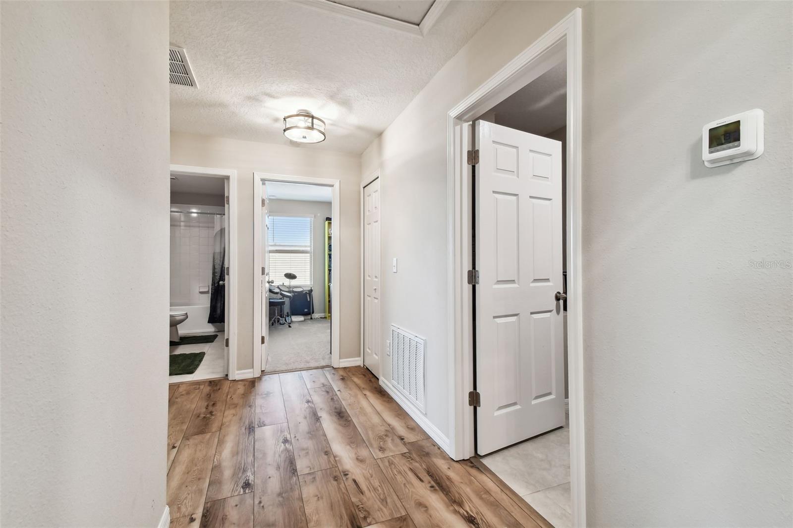 Hallway to secondary bedrooms and laundry