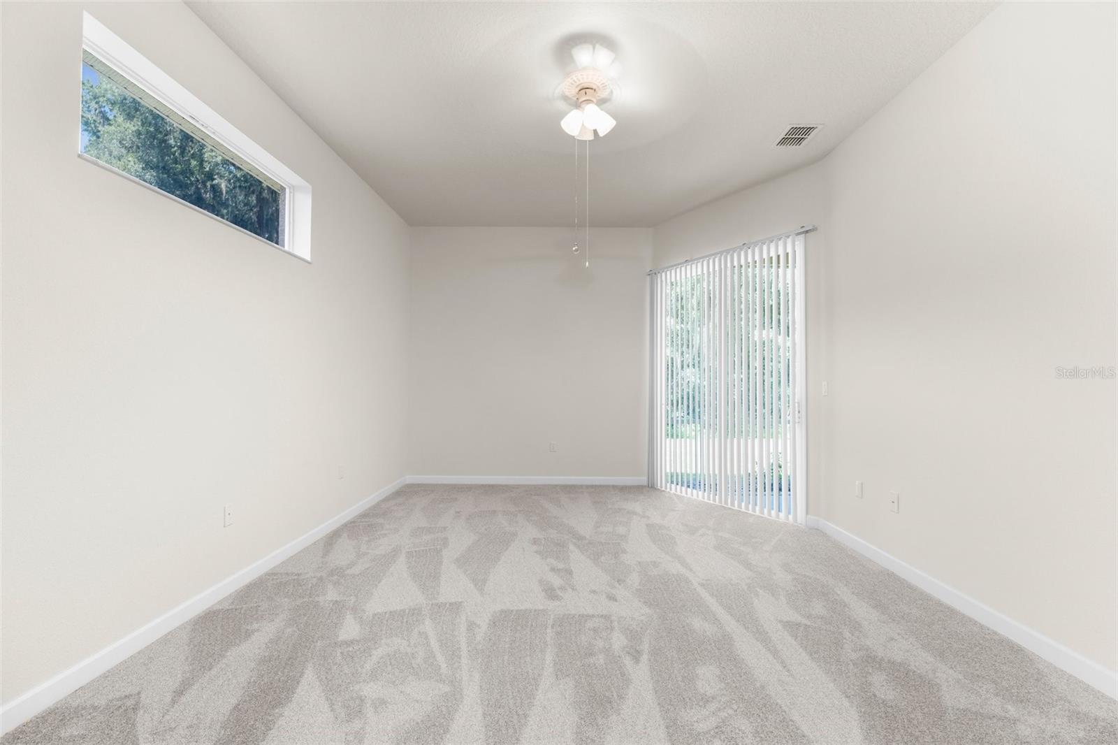 Large master bedroom with glass sliders to the lanai!