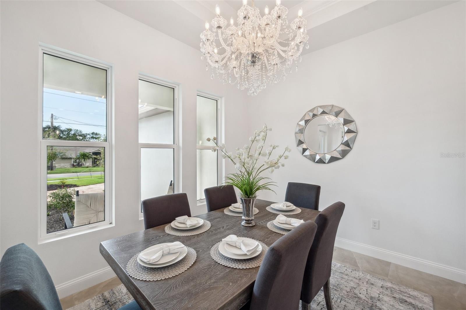 Exquisite chandelier and tray ceiling in Dining Room