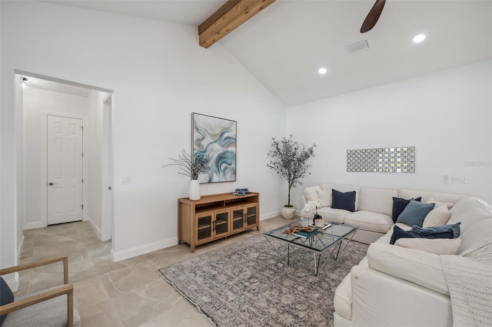 Living Room with cedar plank adorned vaulted ceiling