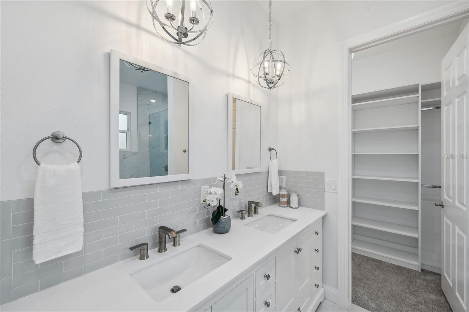 Primary en-suite Bathroom with Walk-In, custom designed closet