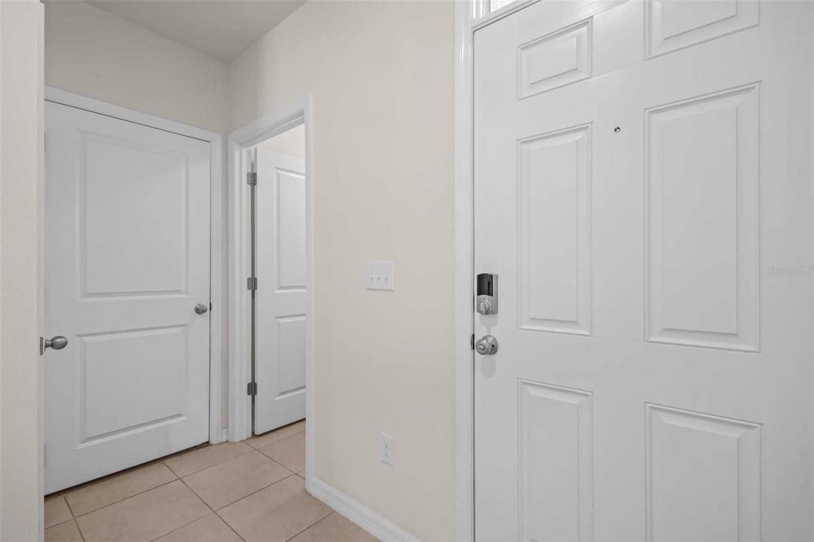 Entry of Home - doors lead to laundry room and 2 car garage