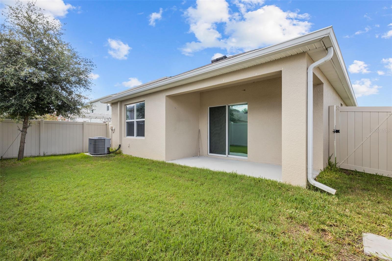 Fenced In Backyard with covered area