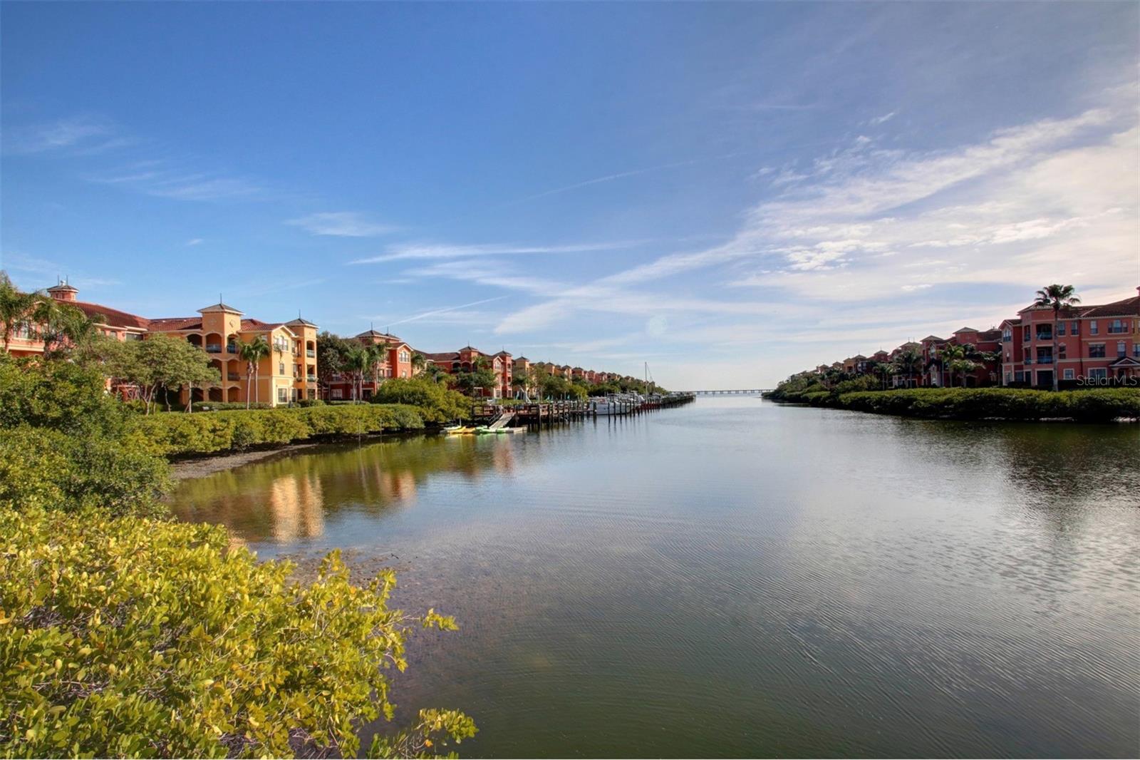 Inlet abutts The Grand Bellagio community on both sides flowing out to Old Tampa Bay