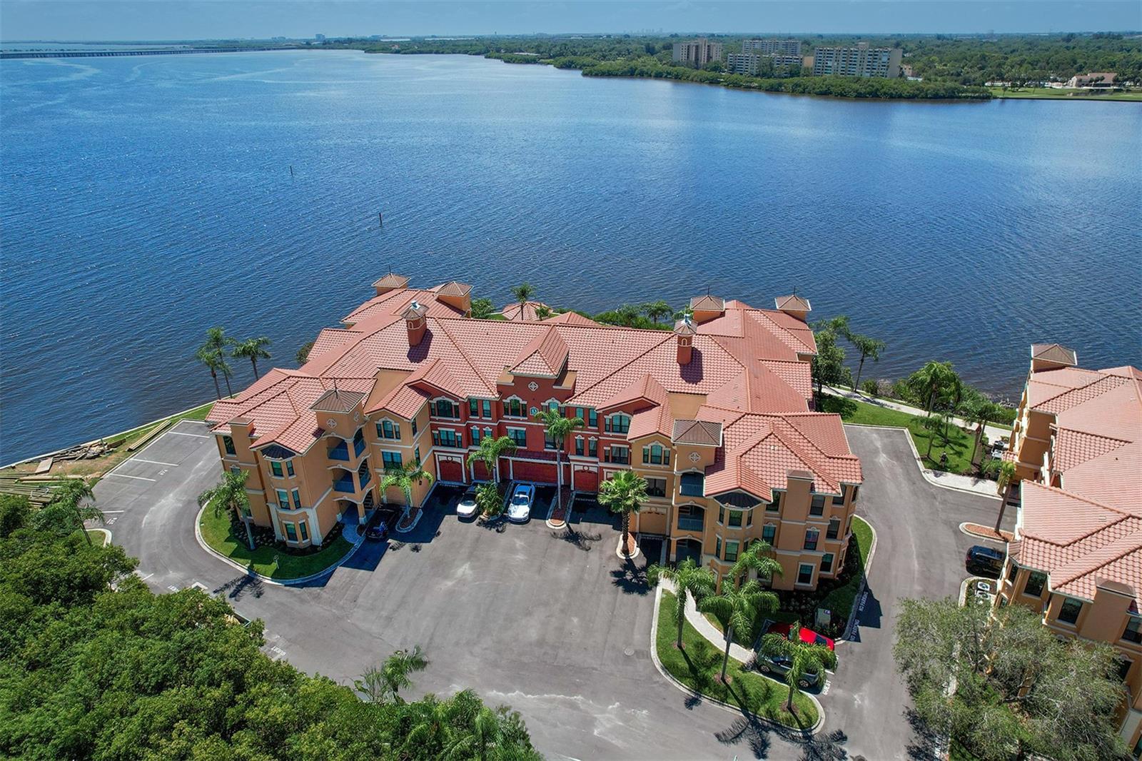 Aerial view of Building 13 on the point of the community property overlooking the Bay and the Bayside Bridge