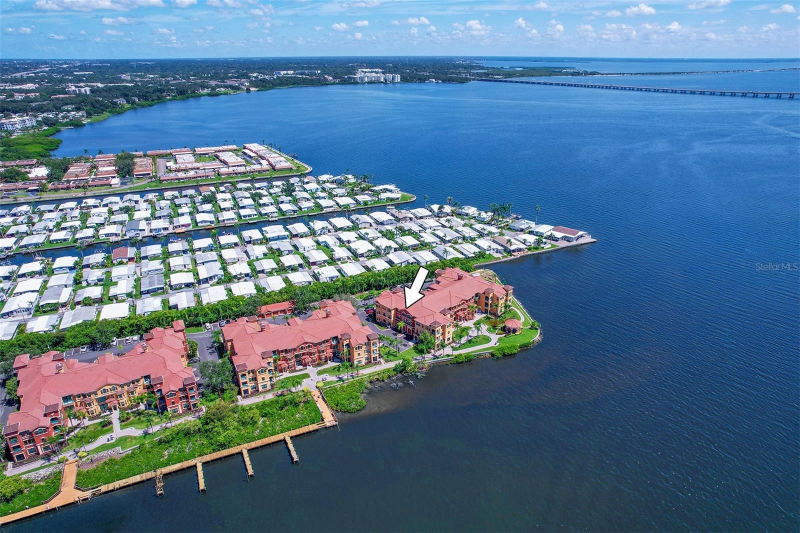 Arrow shows location of Condominium 1332B with respect to the waterway and open bay - see how the building is angled to capture full water views from the condominium