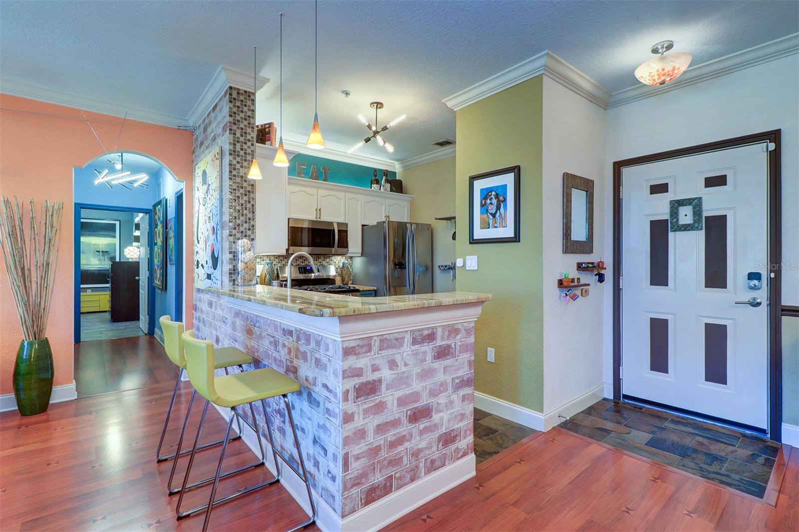 View of the kitchen  down the hallway to bedrooms and bath areas