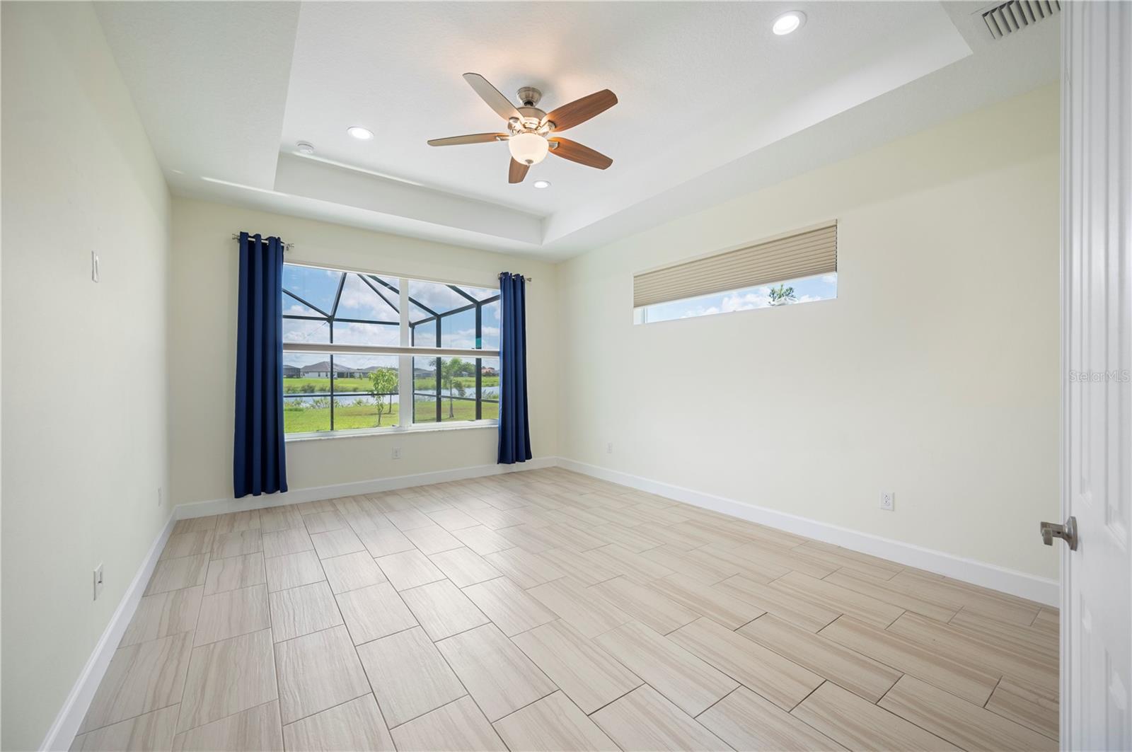 Primary bedroom w/ remote control black out blinds