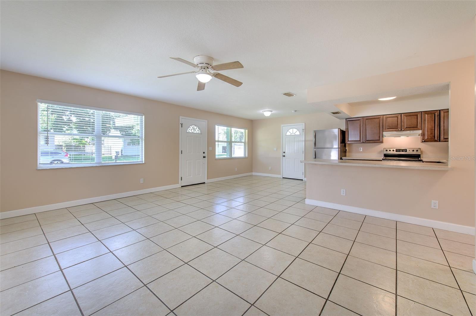 Living area with view to the dinette area and kitchen