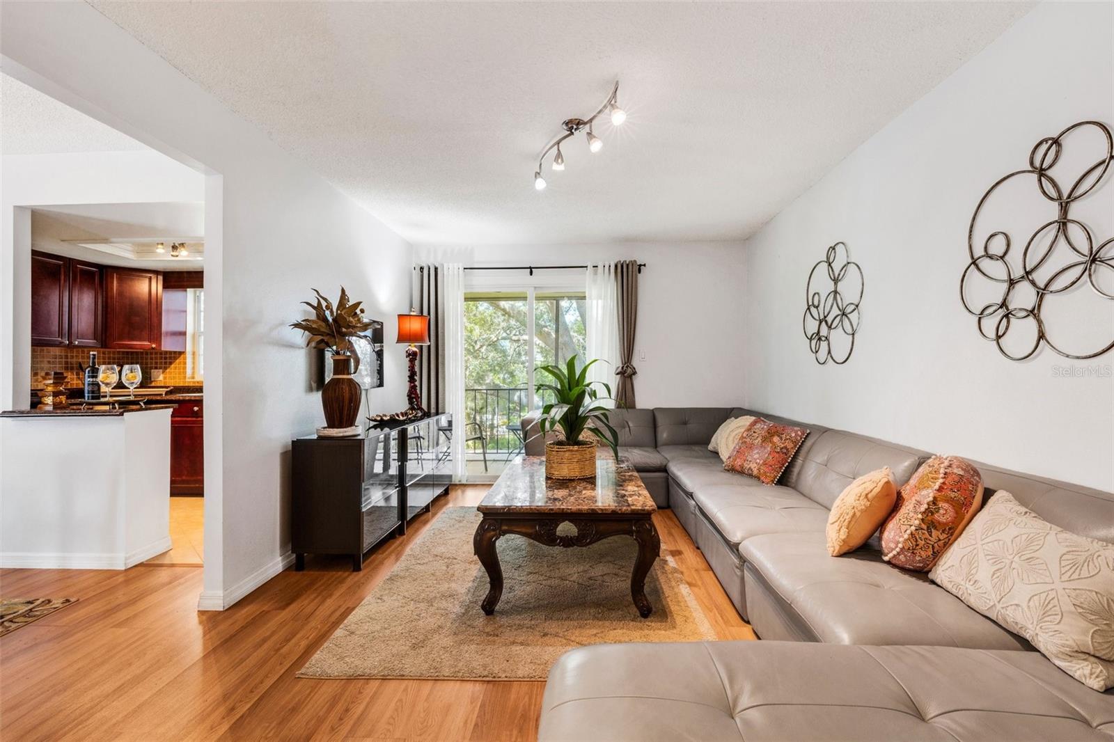 Main living area with balcony.  Furniture conveys!