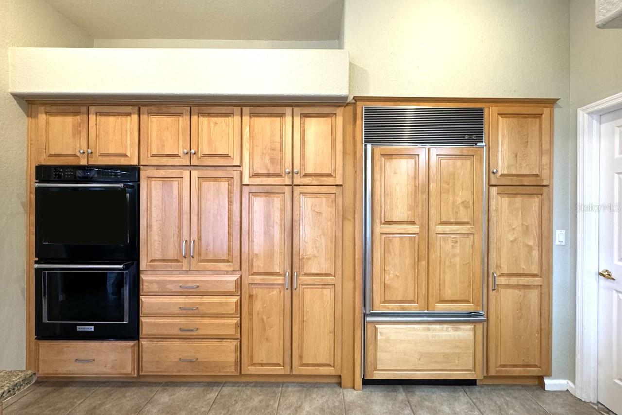 Chef's delight Kitchen with double ovens, paneled sub zero Refrigerator and pantry pulls