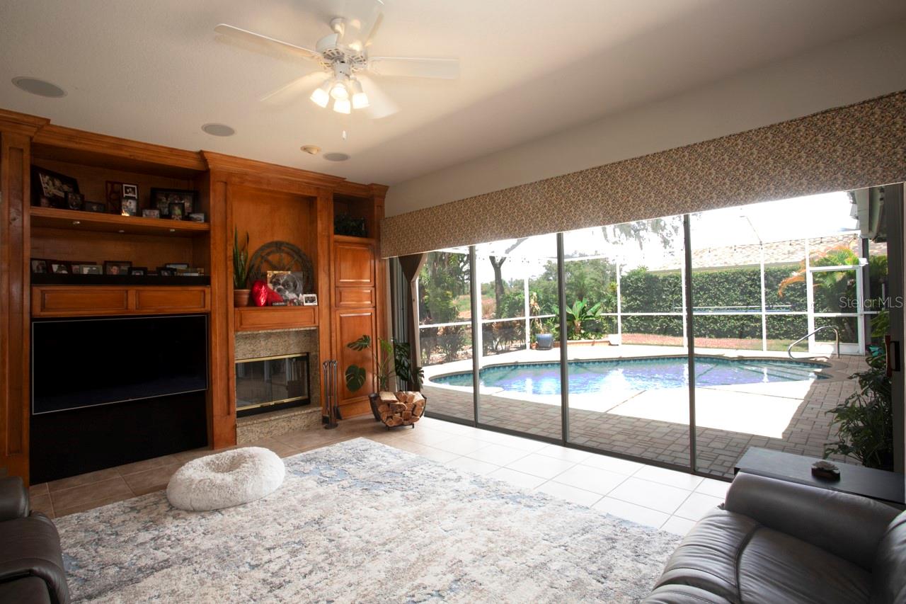 Great for entertaining: Family Room & Pool view through quadruple glass sliders