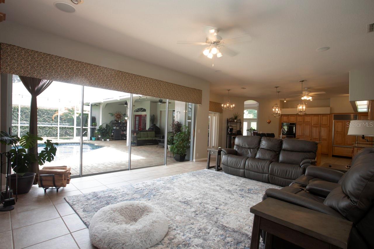 Open and spacious Family Room with view of Lanai & swimming Pool