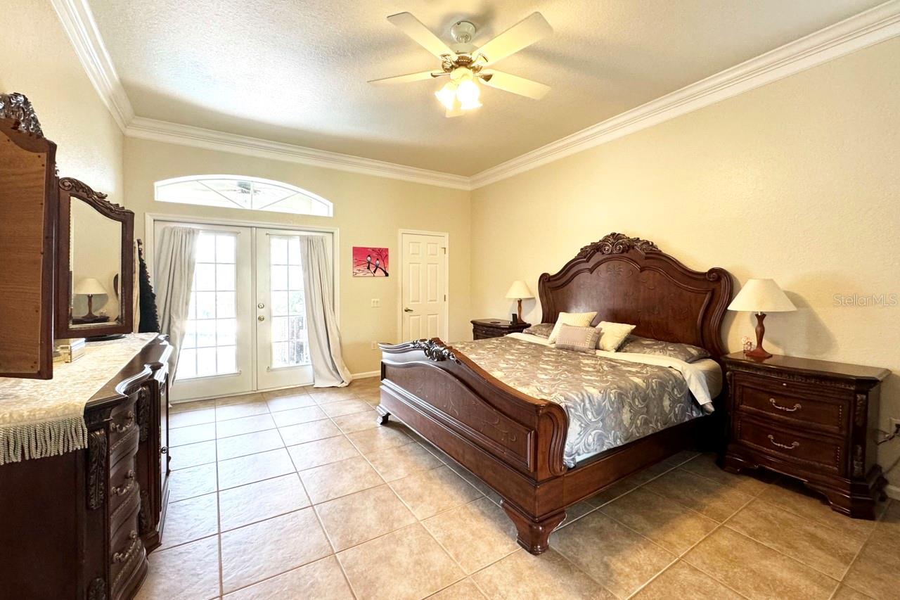 Nice soaring ceilings with crown moulding...This is the Primary Bedroom