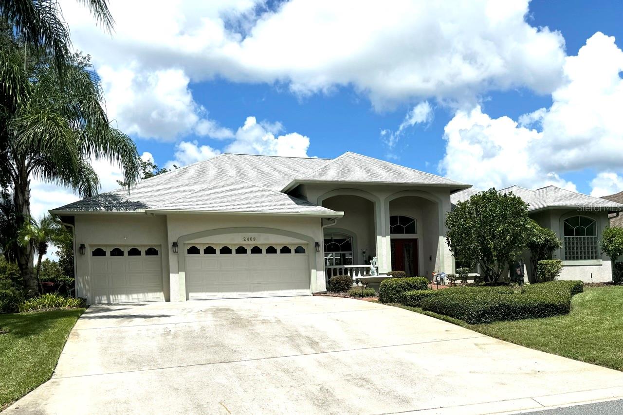 Spacious Front 3-car garage, and view of the front porch entry and right front side