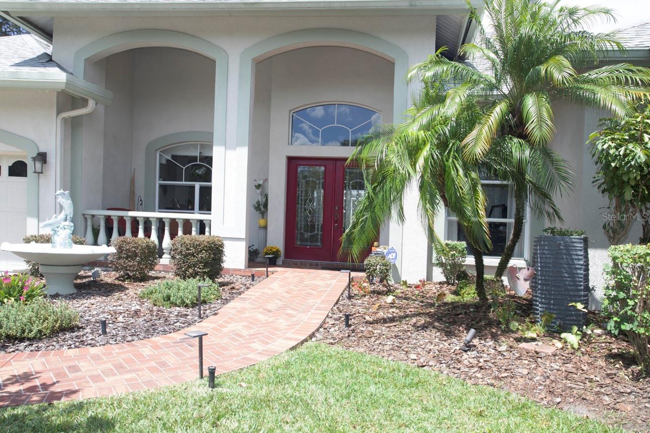 Nice covered front patio and beautiful Beveled Glass Front double doors