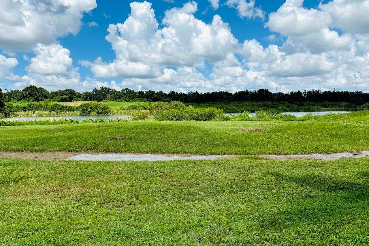 Take time to walk the trails along the back yard lake