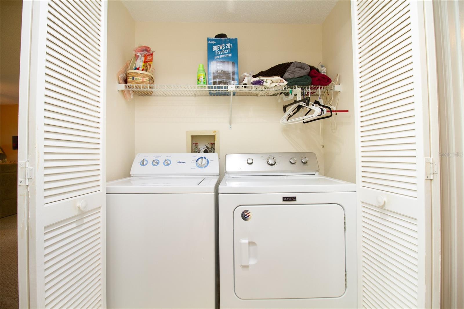 Inside washer and dryer.