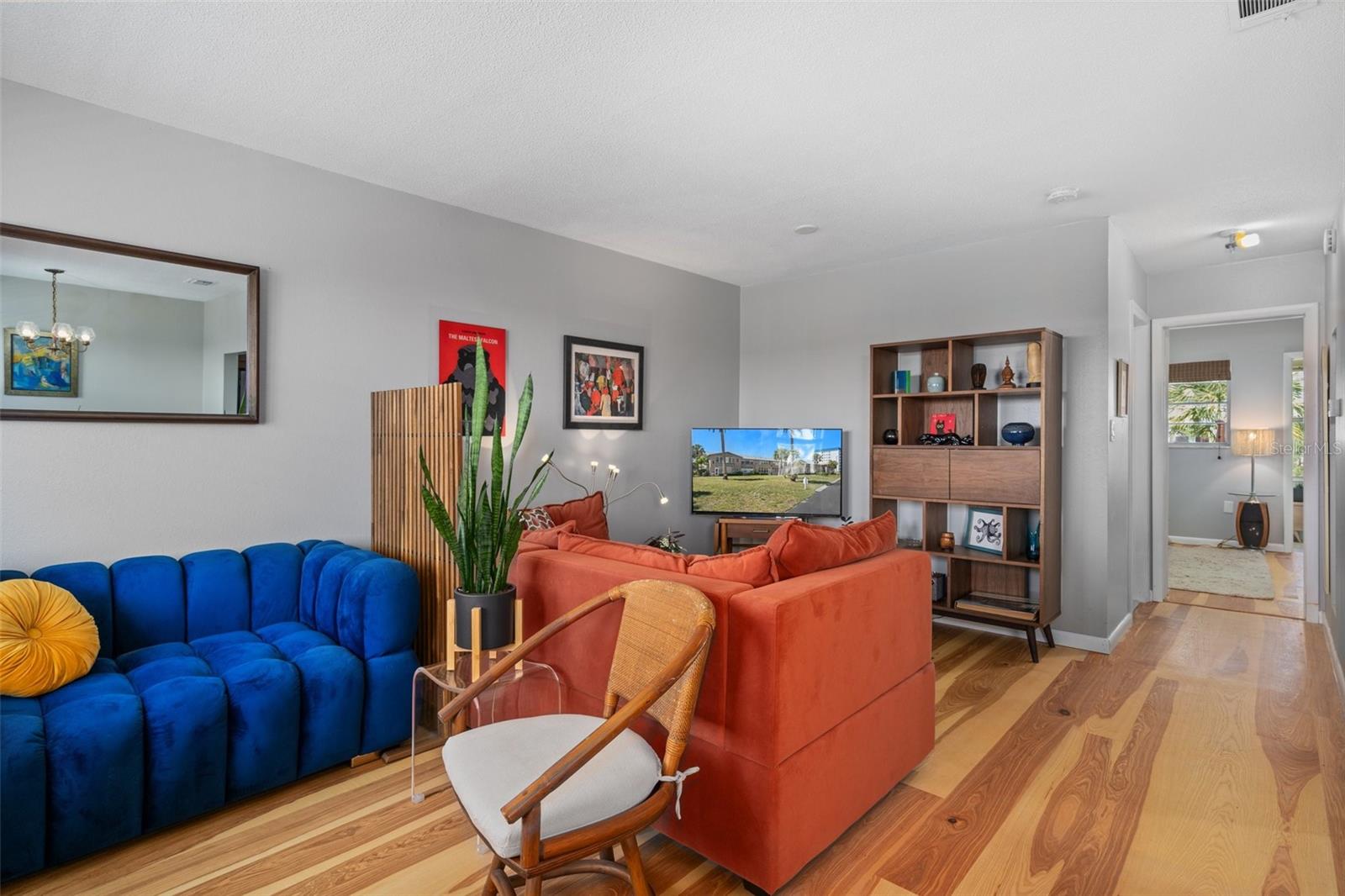 The spacious living room is open to the kitchen and dining room.