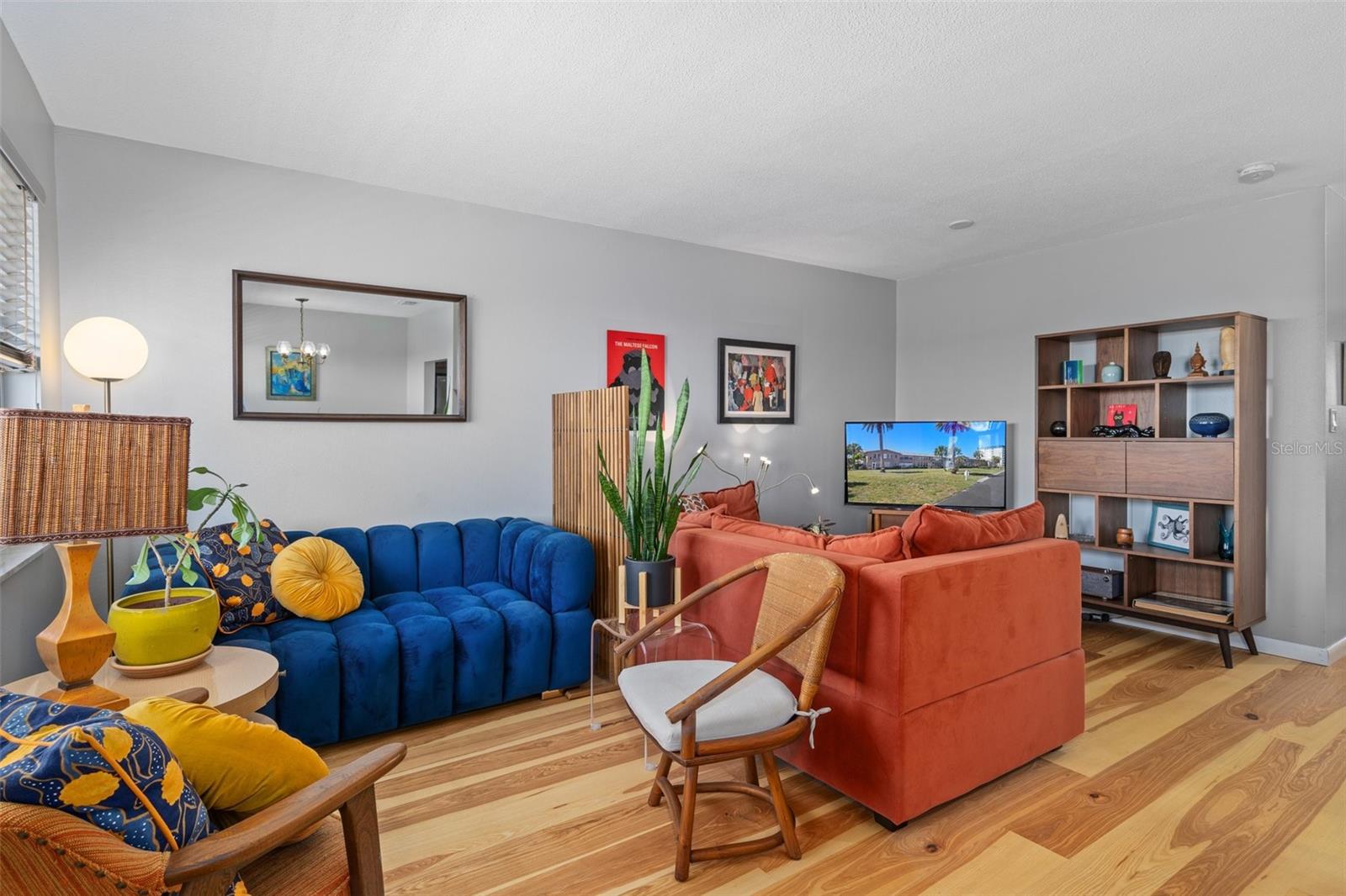 The living room features recessed lighting and a picture window.