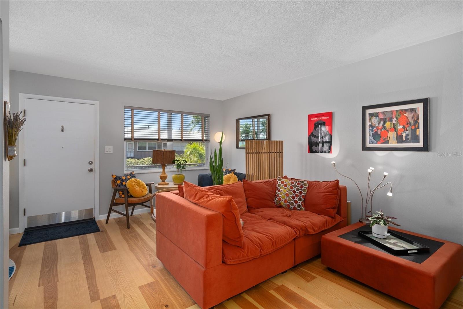 Plenty of natural light flows through the living room's picture window.