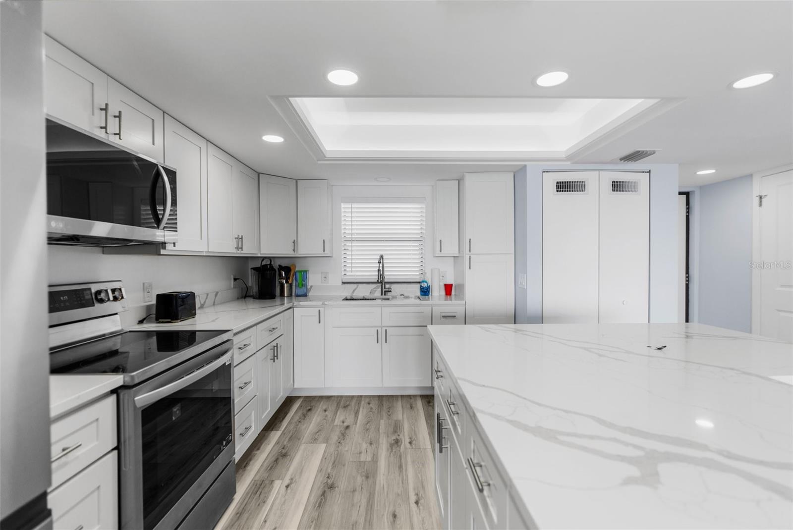 Expansive kitchen, wall was removed for open floor plan for a spacious feeling.