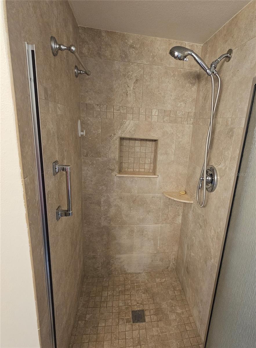 Shower has safety bars.