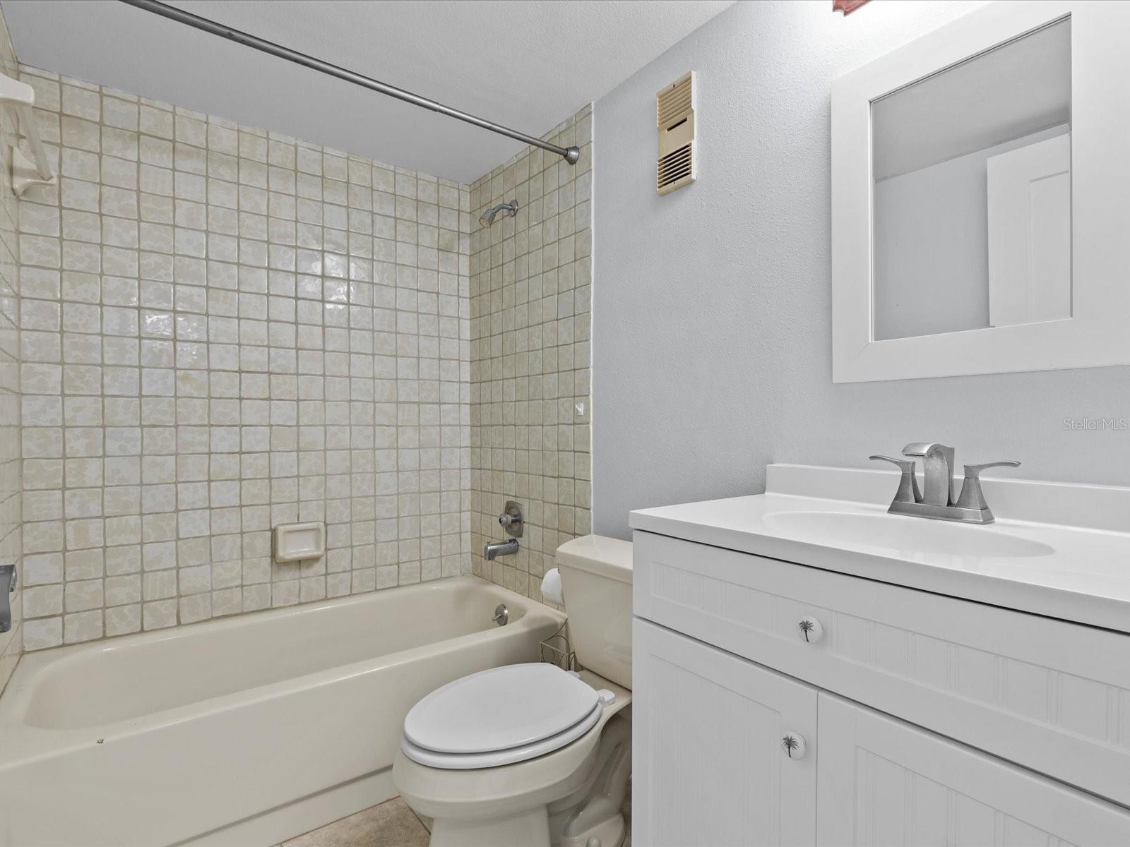 Main bathroom located across the dining room area.